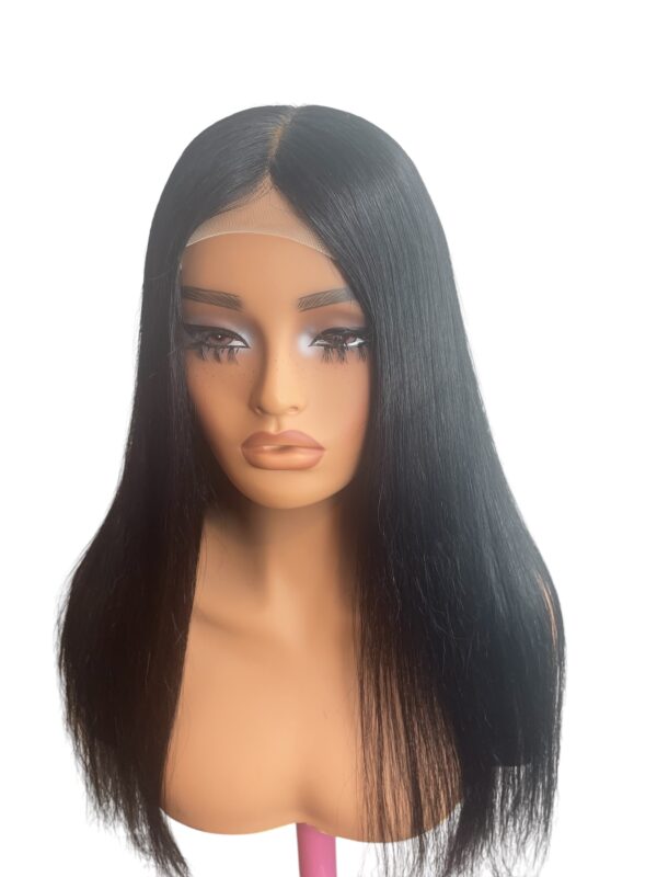 A woman 's head with long black hair.